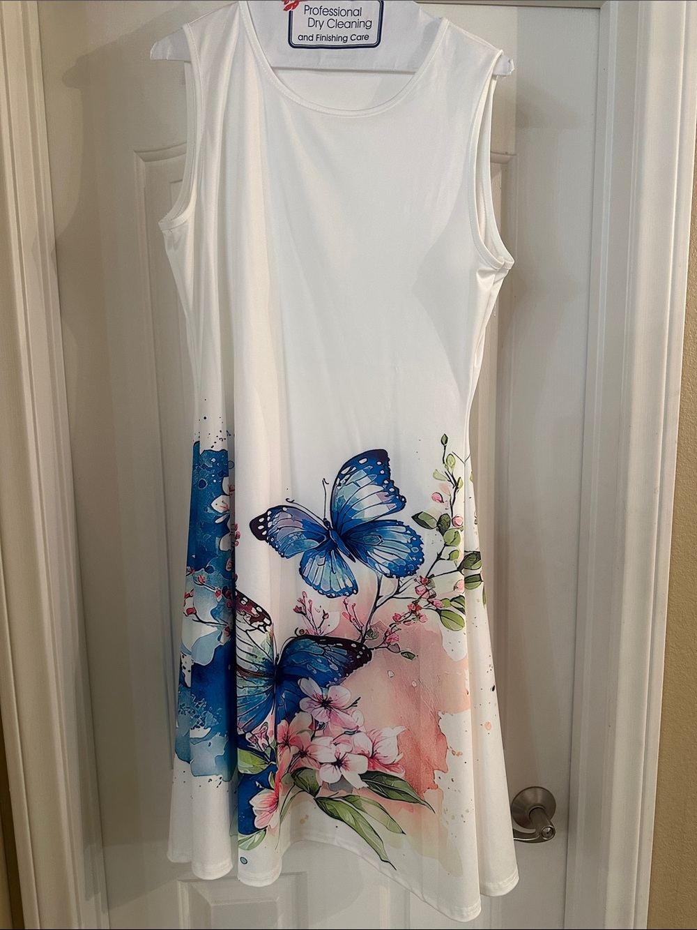 White Sleeveless Dress with Blue Butterfly Print